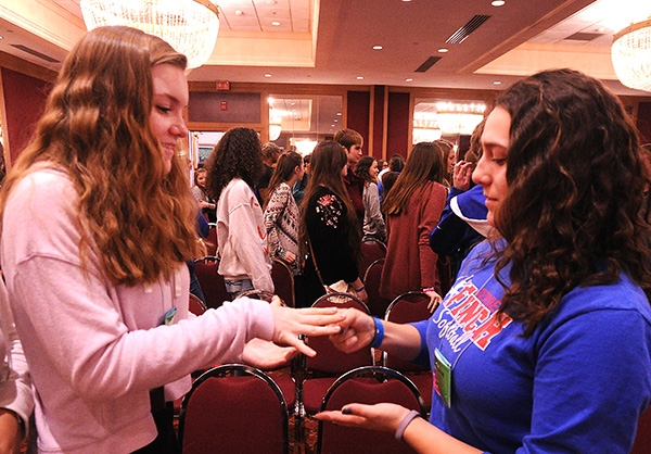 Riley McGloin, of St Francis, and Brianna Janizenski, of St. Peter and Paul, play rock, paper, scissors during the  